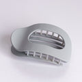 Gray hair clip on a white background