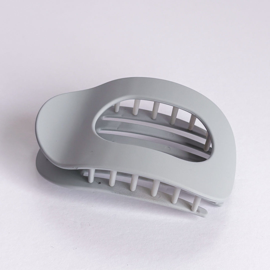 Gray hair clip on a white background