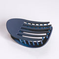 Blue plastic hair scoop on a white background