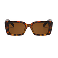 Sunglasses with tortoiseshell frame and brown lenses on a white background