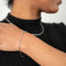  A bracelet is silver-coloured have a chain link design made of small, rectangular links.