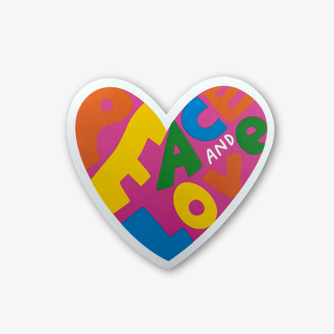 Heart-shaped sticker with colorful letters spelling 'PEACE AND LOVE' on a white background