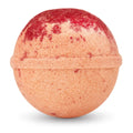Bath bomb with red and beige coloration on a white background