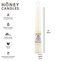 Two cream-colored beeswax candles are standing upright, tied together with a string. The candles have a label that says "HONEY CANDLES Pure Beeswax." The label also includes information about the candles, such as the fact that they are made in Canada, family-owned, and handmade in small batches.
