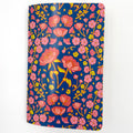 Floral notebook with pink flowers on a blue background