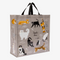 A reusable tote bag with a cat-themed design. The bag is a light grey color with black handles. It features a variety of cats in different poses and breeds, including a white fluffy cat, a black cat, a tabby cat, and a Siamese cat. The text 