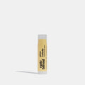 A white tube of Epic Blend Pina Colada Hydrating Lip Balm with a yellow label. The label displays the brand name, "pina colada hydrating lip balm," and indicates it's made with organic ingredients.