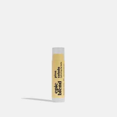 A white tube of Epic Blend Pina Colada Hydrating Lip Balm with a yellow label. The label displays the brand name, 