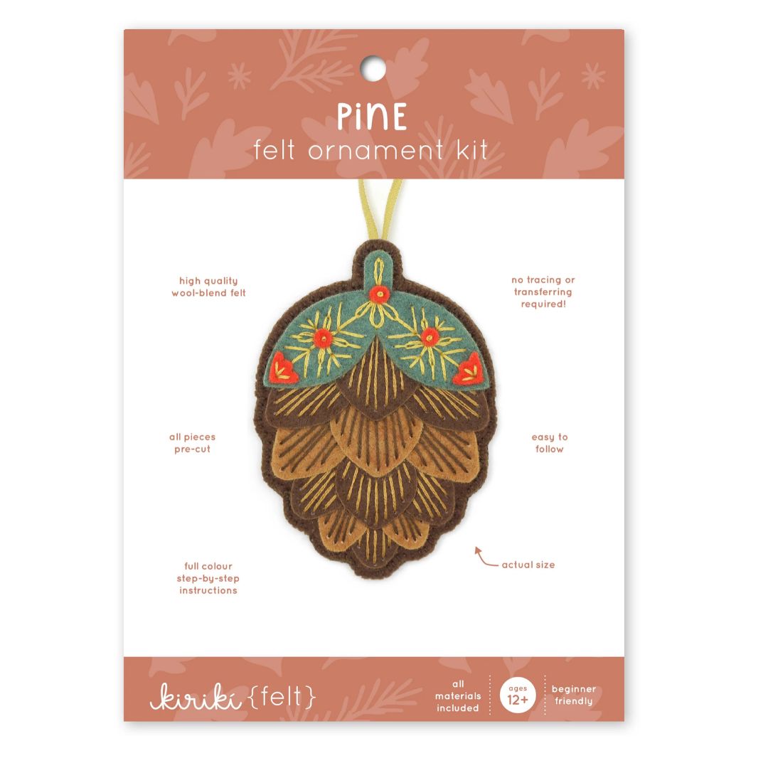 Kiriku {felt} Pine felt ornament kit by Kiriku Fabrics, featuring a felt pinecone ornament on its original packaging card.