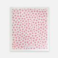 White towel with pink floral pattern and 'naturebee' branding on a white background