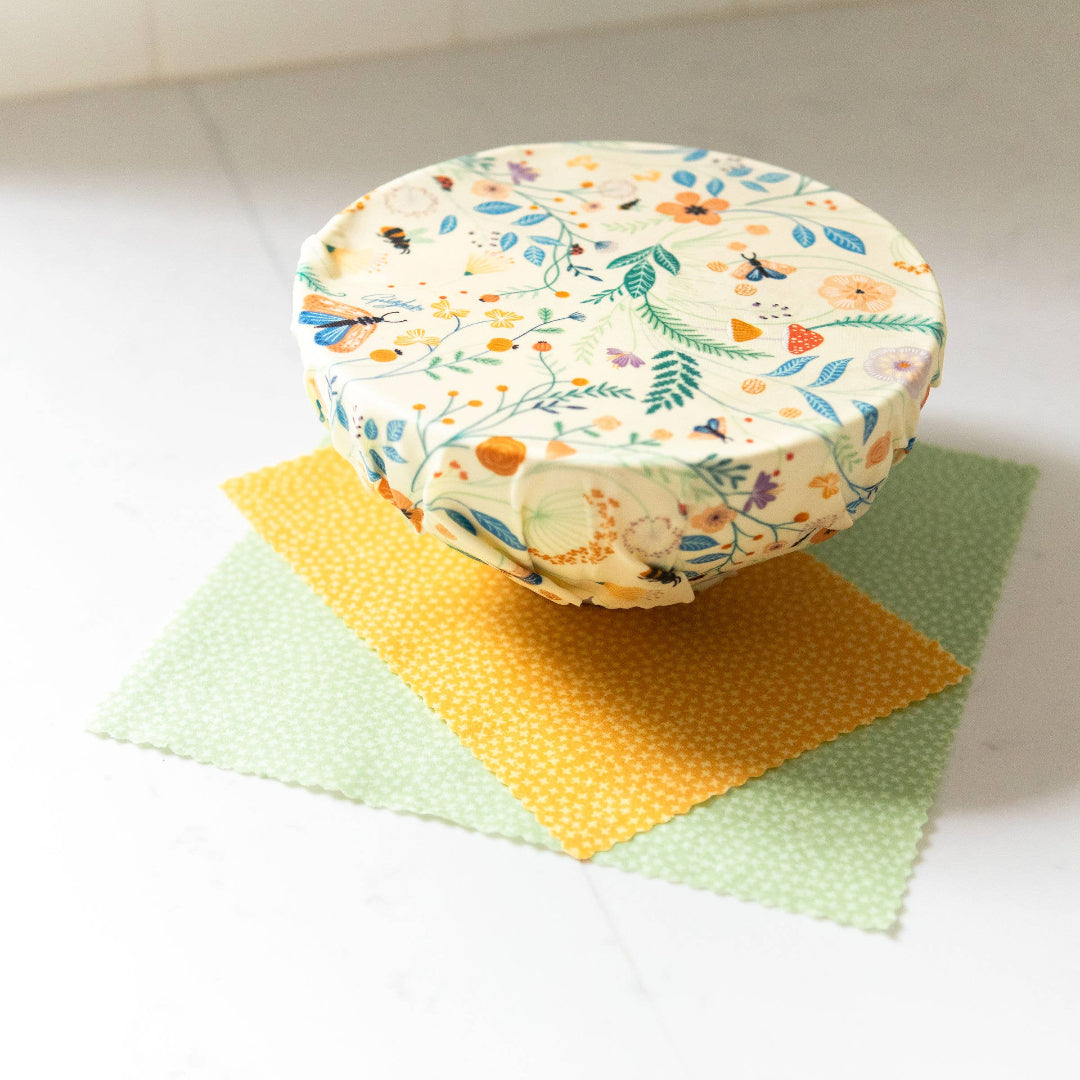 Reusable food container with floral pattern on a white surface