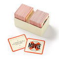 Set of playing cards with red and beige design in a box on a white background