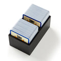 Black card holder with two decks of cards on a white background