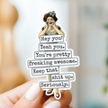 Sticker with text and illustration of a woman on a blurred background
