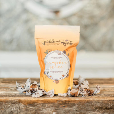 A plastic bag filled with caramel candies. The bag has a label that says 