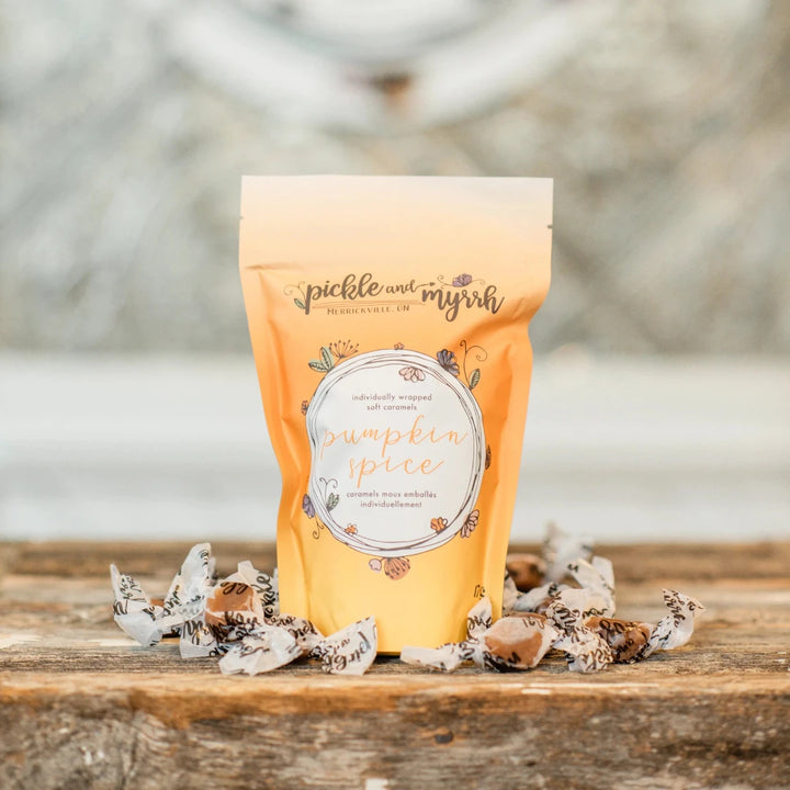 A plastic bag filled with caramel candies. The bag has a label that says 