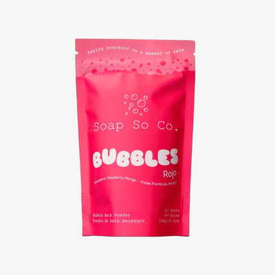 Pink package of Soap So Co. Bubbles Roja on a black background