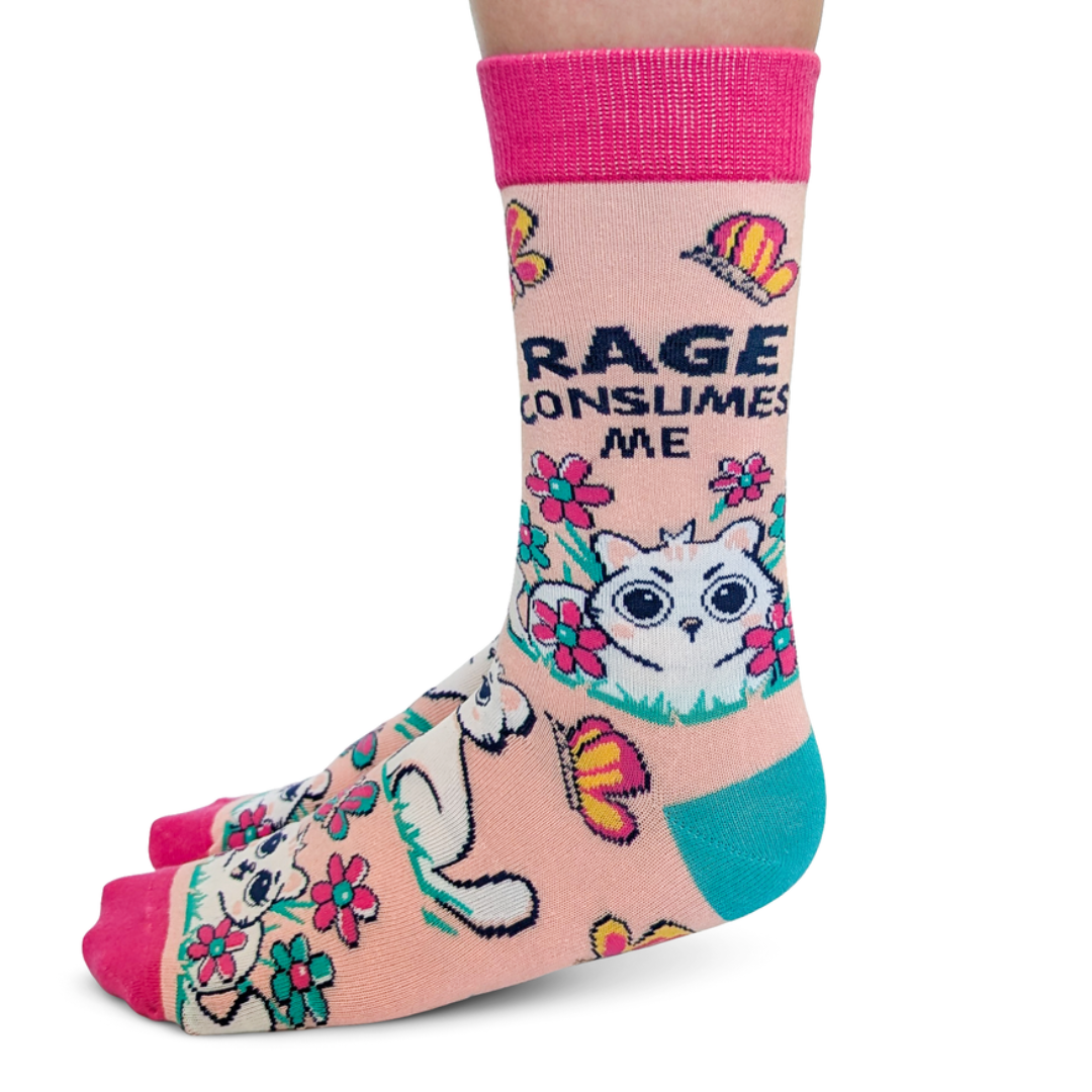 Colorful sock with cat design and text on a white background
