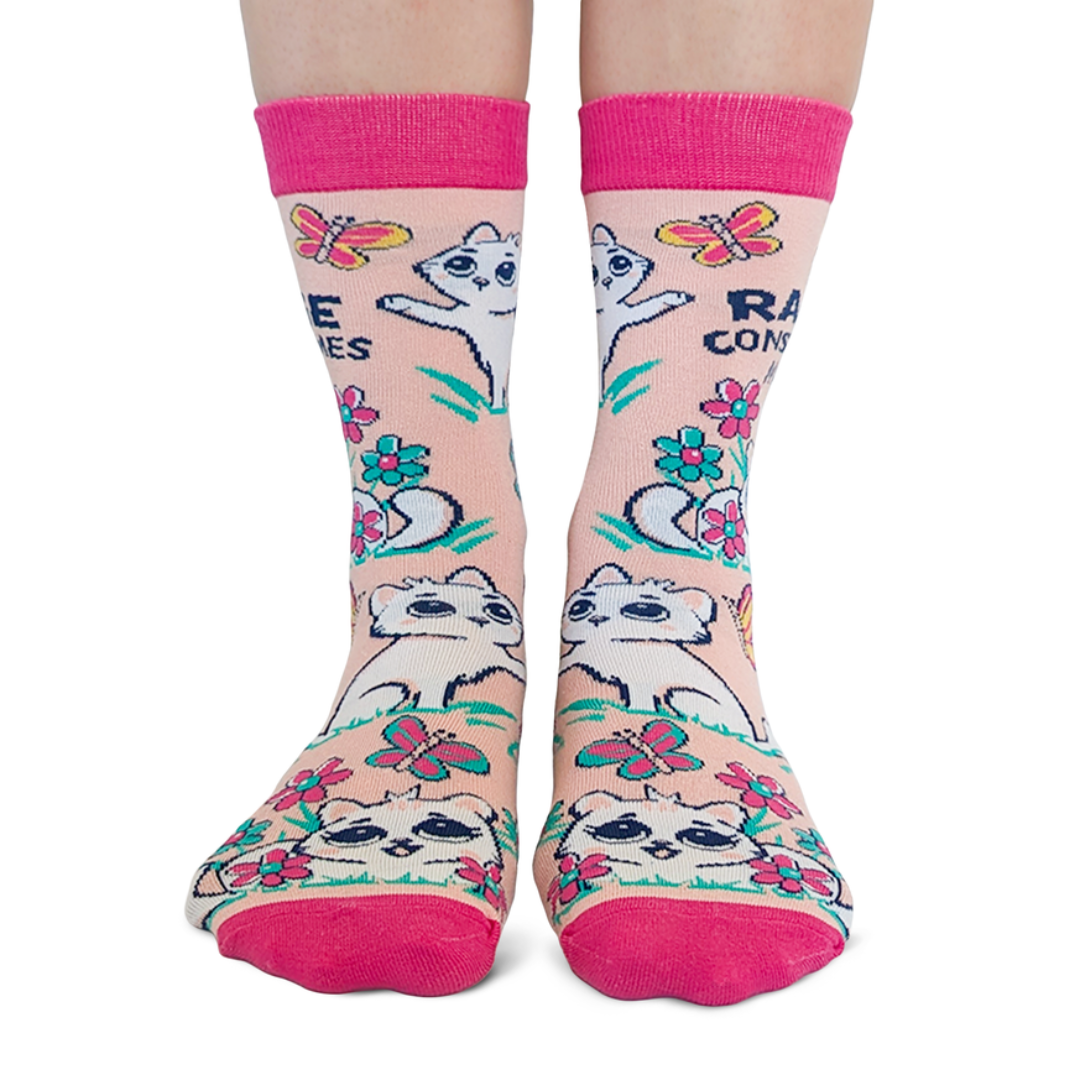 Colorful socks with raccoon designs and text on a white background