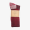 A pair of red socks rolled up and packaged with a label that reads 