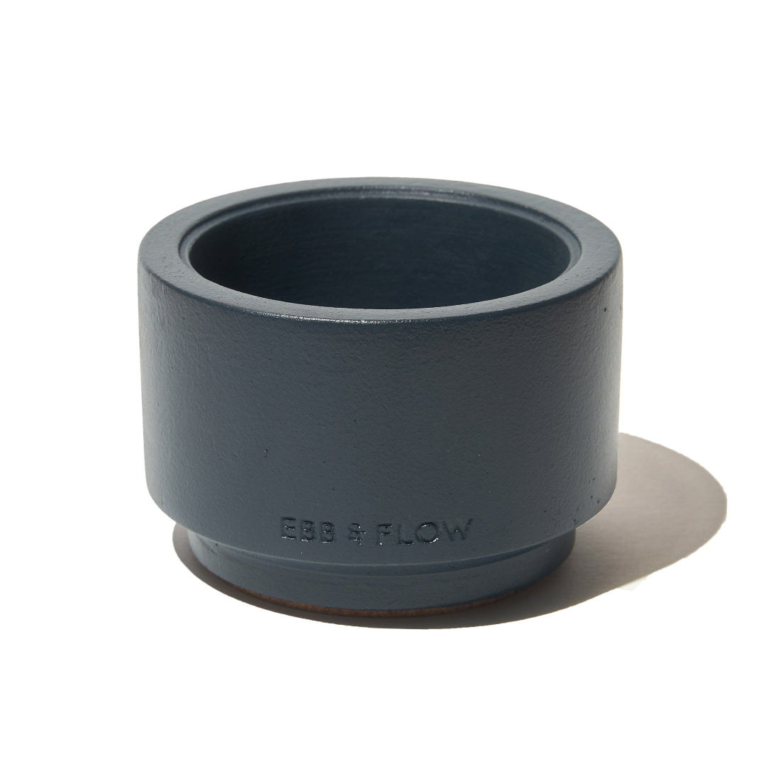A dark gray cylindrical pipe fitting with embossed 'COB + FLOW' branding, shown on a clean white background with a soft shadow.