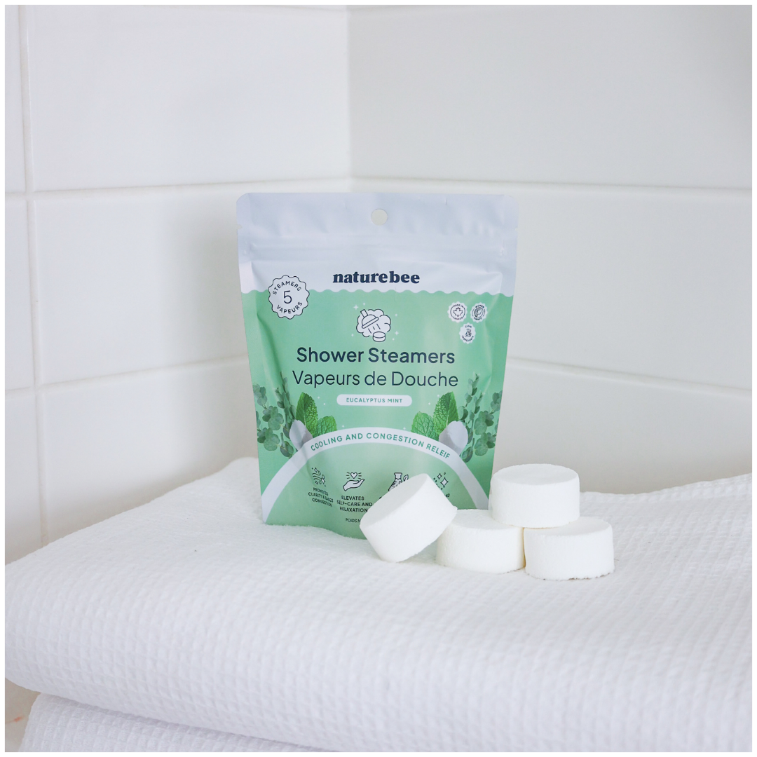Naturebee shower steamers with packaging on a white surface