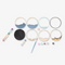 A Paint By Layers Craft Kit featuring a circular shadow box with a pre-designed landscape scene. The scene depicts a mountain range under a starry night sky, with a river flowing through a valley. The kit includes layers of wood, paint, and instructions. The title of the kit is 