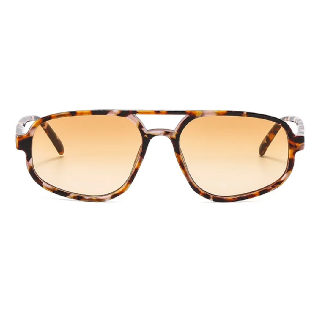 Sunglasses with tortoiseshell frame and orange lenses on a white background