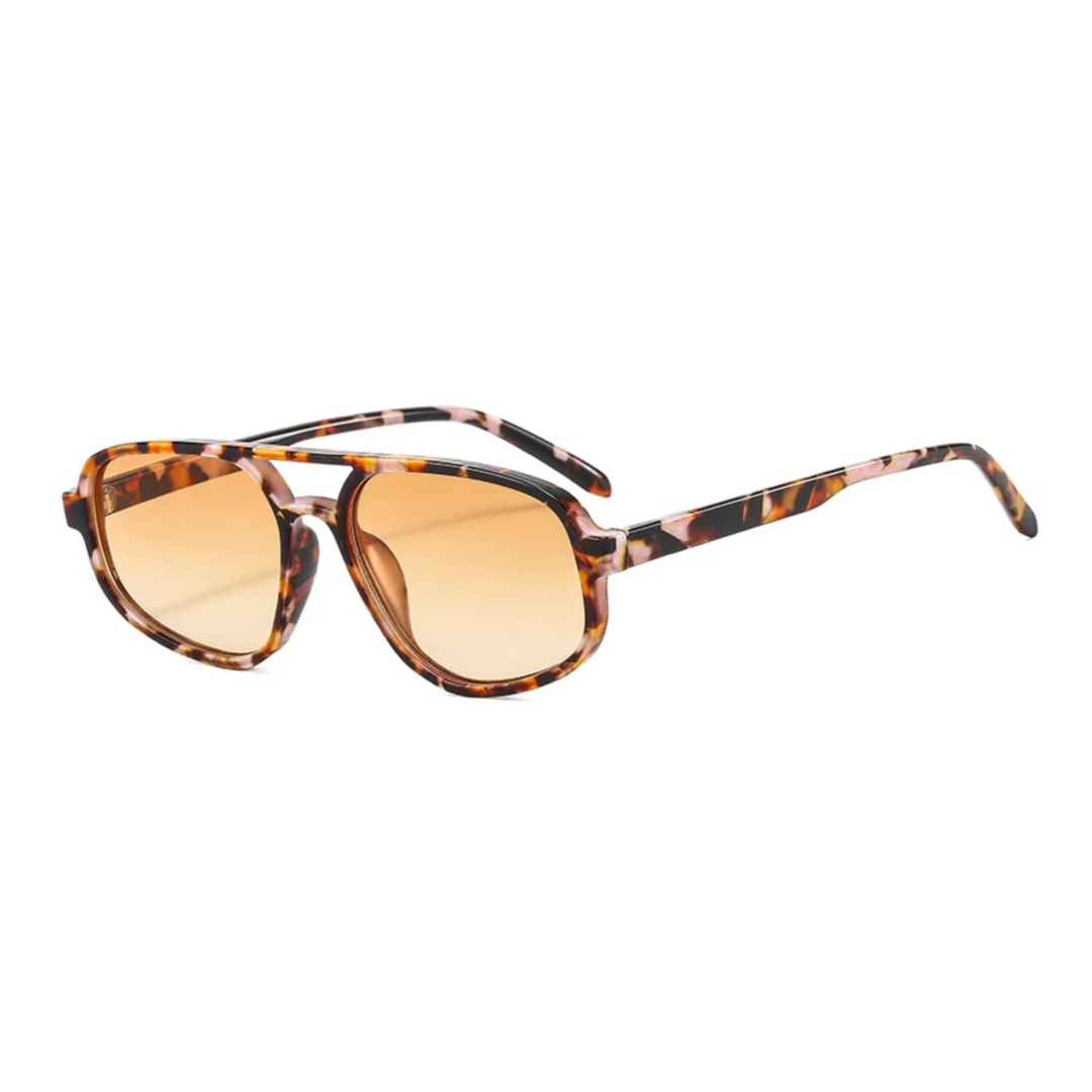 Sunglasses with tortoiseshell frame and orange lenses on a white background