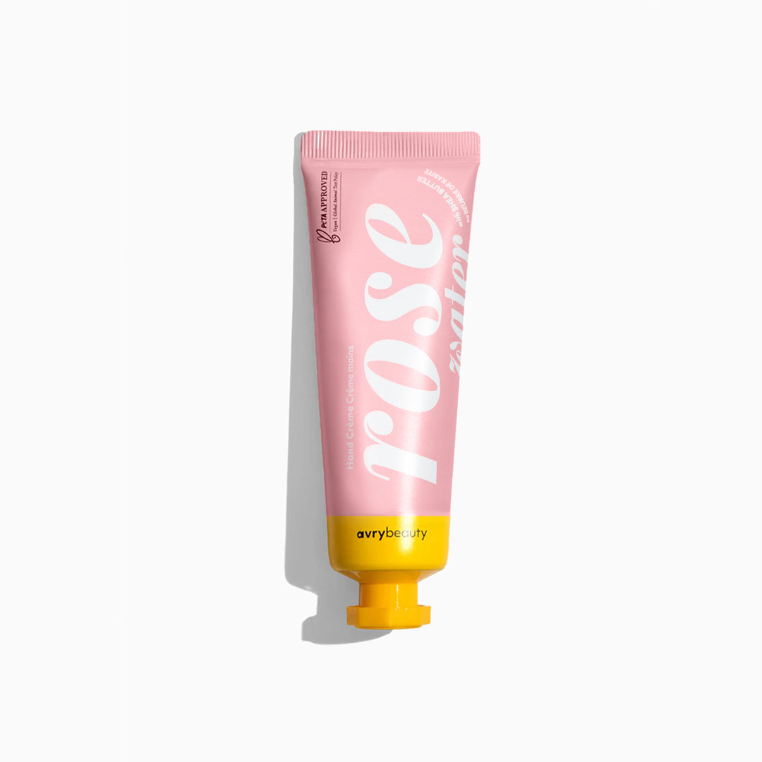 Pink tube of 'Rose' hand cream with yellow base on a white background