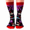 A pair of black socks with a Halloween-themed design. The socks feature a zombie hand, skulls, tombstones, and the phrase 
