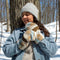 Sand Mittens, an indigenous designed mitten with a beige and blue pattern. The mittens have a wool outer layer and sherpa inner lining.