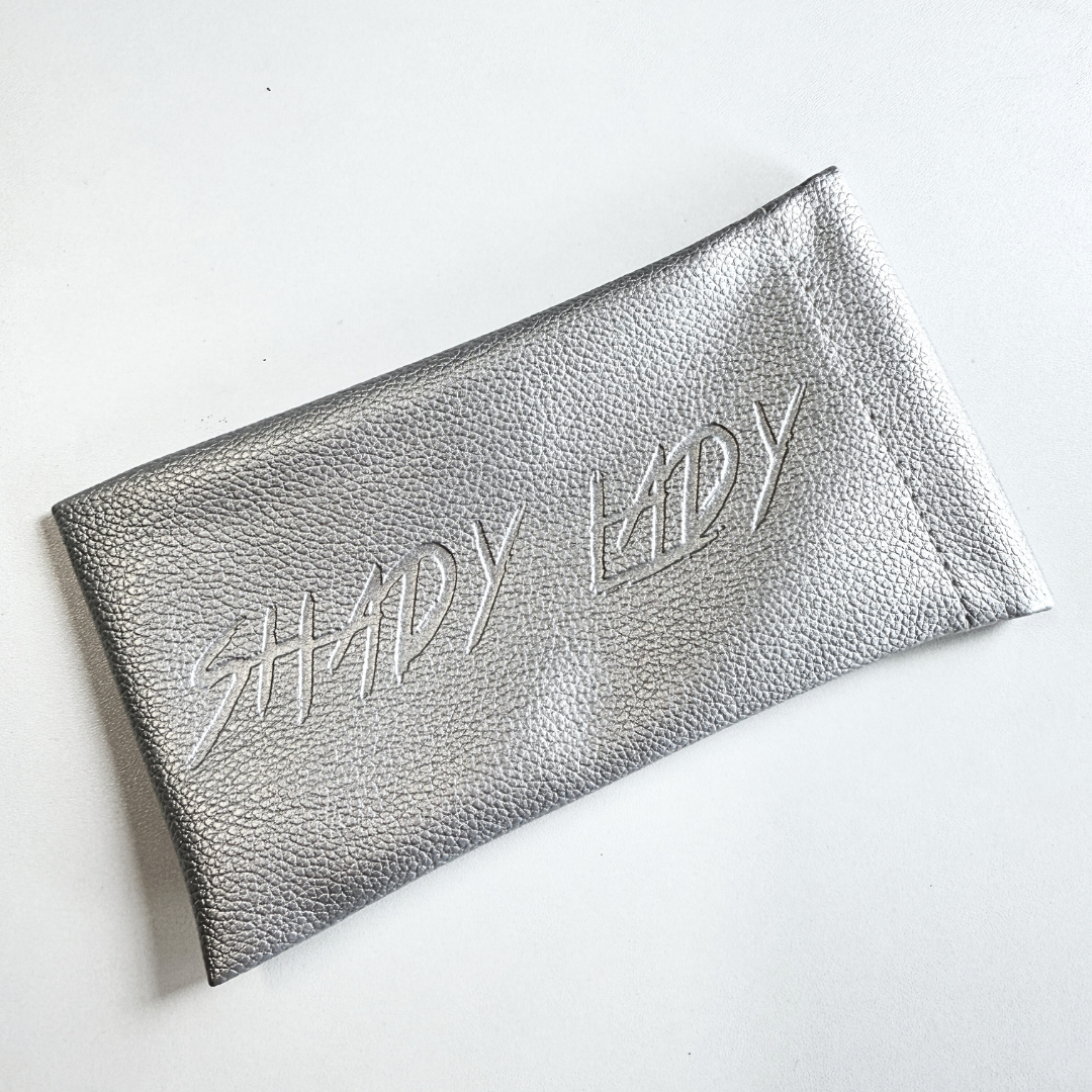 Silver clutch bag with 'SHady Lady' text on a white background
