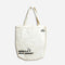 A white tote bag with a black illustration of a goose wearing a cowboy hat. The text 