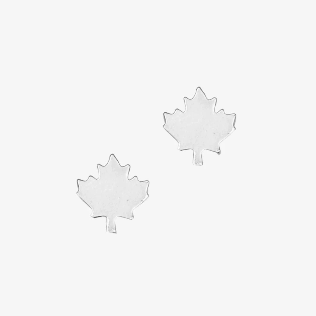 A pair of silver maple leaf stud earrings.