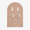 A set of silver earrings with interchangeable charms. The set includes two pairs of silver hoop earrings and three charms: a pearl, the word 