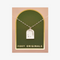 A silver necklace with a pendant shaped like an archway. The pendant has the words 