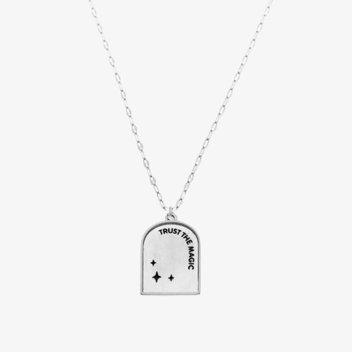 A silver necklace with a pendant shaped like an archway. The pendant has the words 