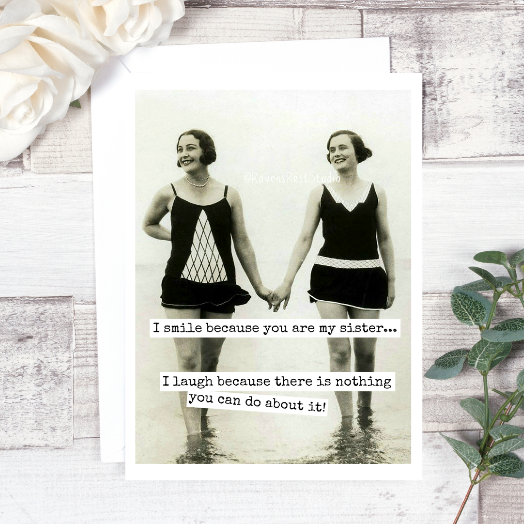 Vintage photo of two women holding hands with a humorous quote on a wooden surface.