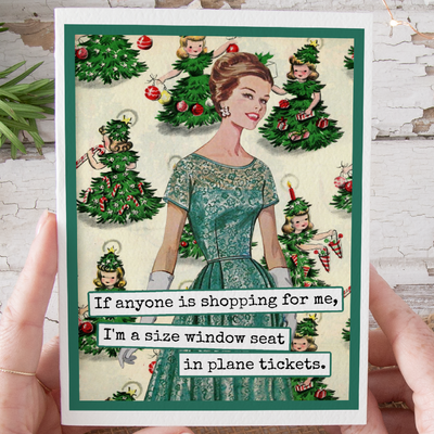 Vintage-style Christmas card with a woman in a green dress surrounded by Christmas trees and children.