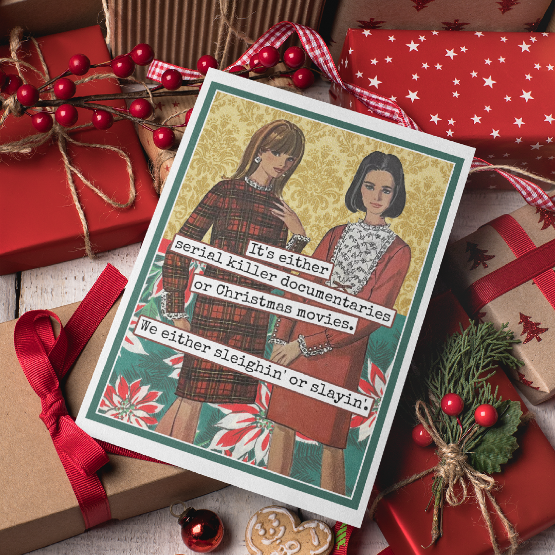 Holiday card with two women and Christmas-themed text, surrounded by gift boxes and decorations.