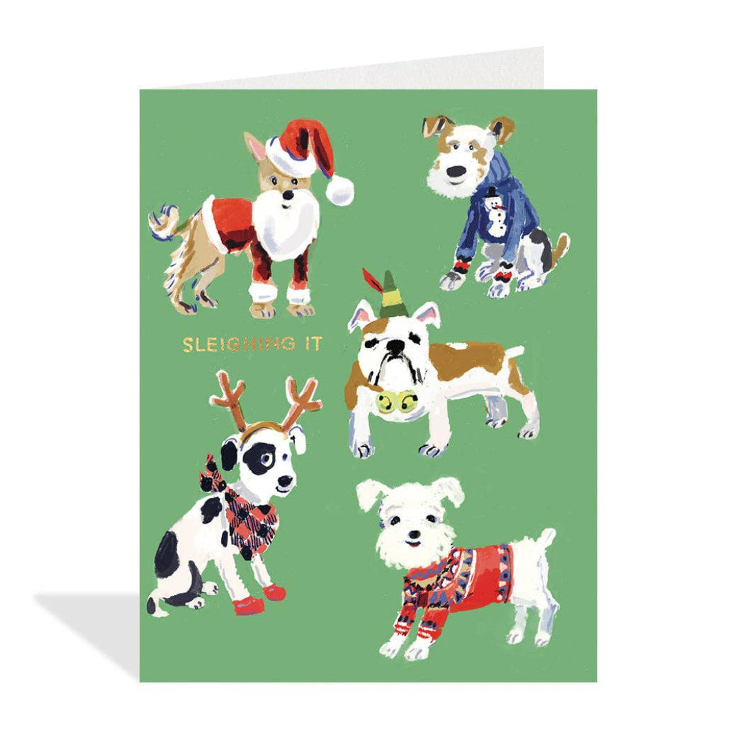 Card with illustrations of dogs in festive costumes on a green background