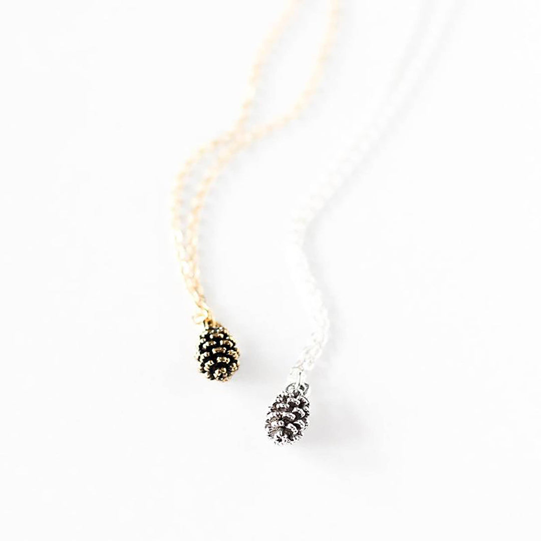 Necklace with pine cone pendants on a white background