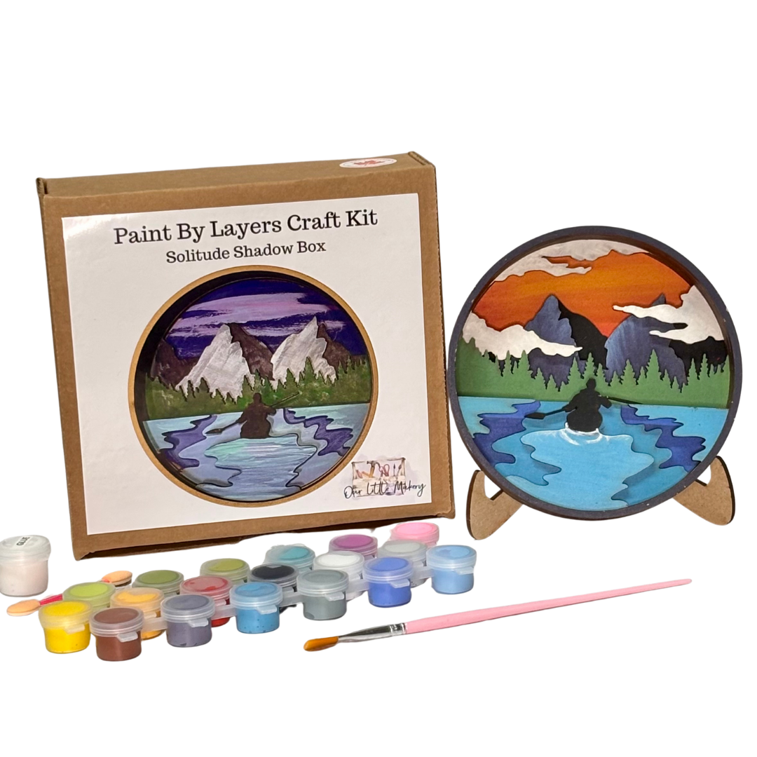 Paint by layers craft kit with painted shadow box and supplies on a white background