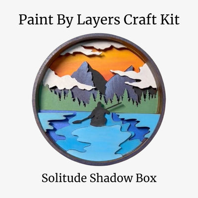 Paint by Layers Craft Kit with a scenic design of mountains and a lake.