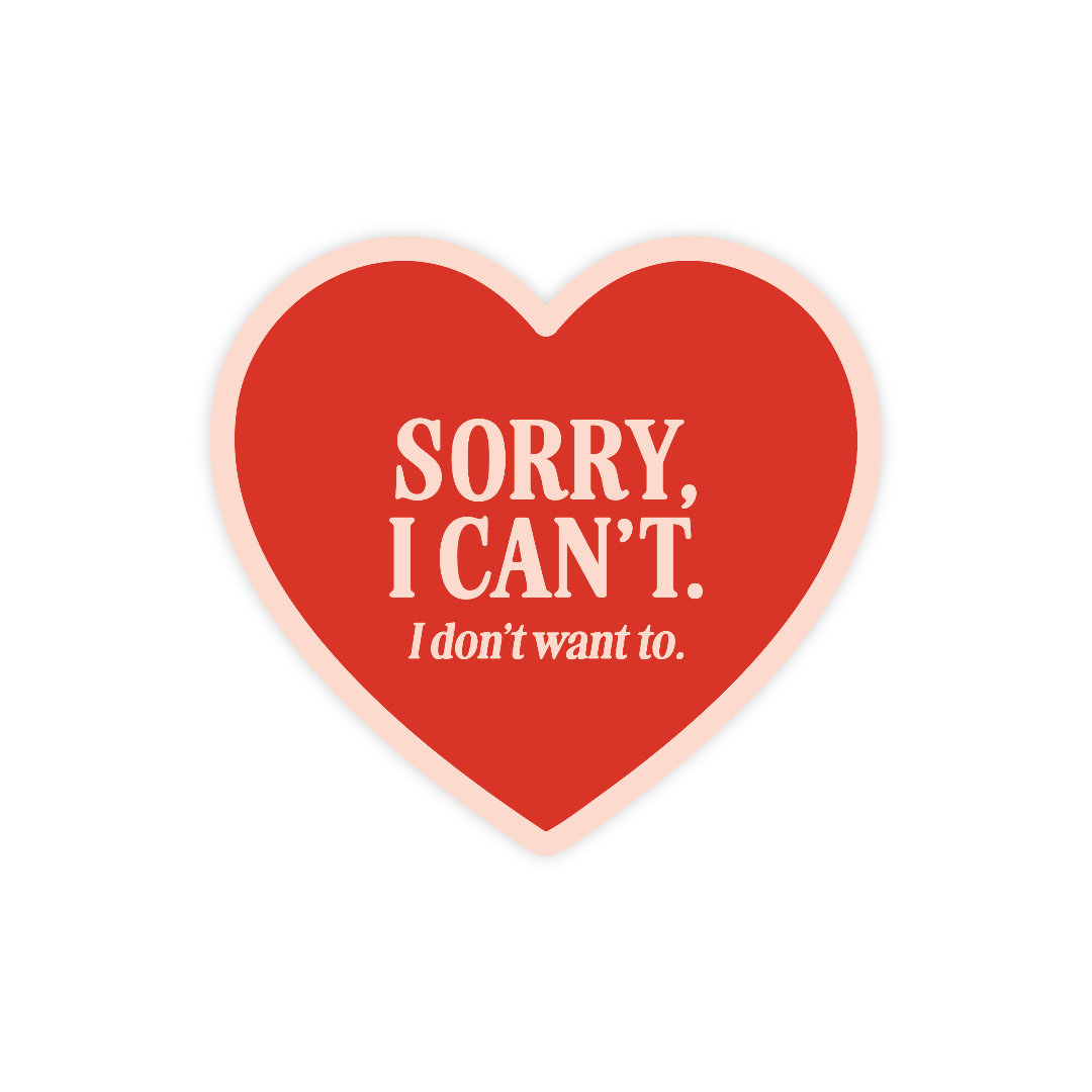 Red heart-shaped sticker with white text on a white background