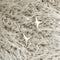 A pair of silver sparkle stud earrings, each featuring a minimalist four-pointed star or starfish-like design, displayed on a textured, light-colored surface. These celestial earrings are available in Ottawa, Ontario, Canada.