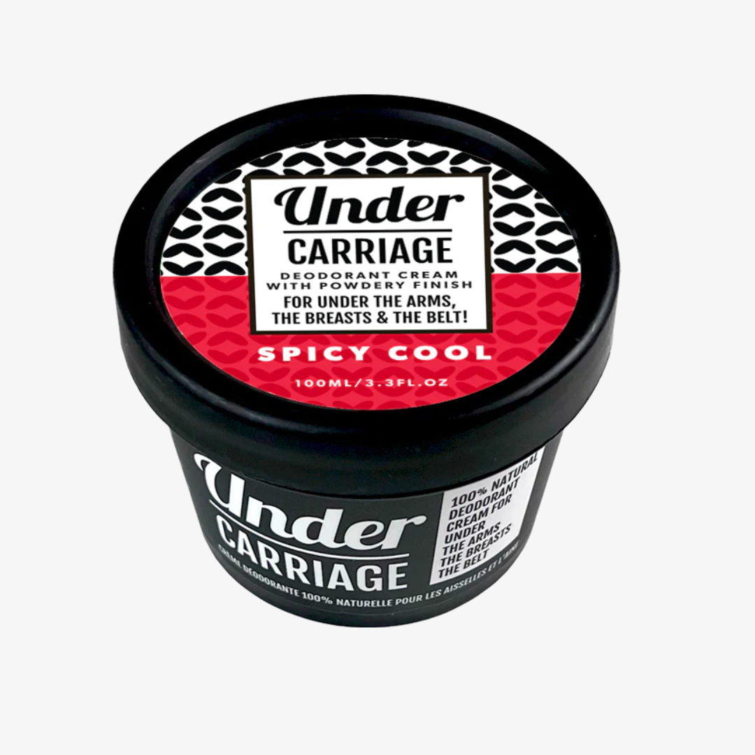 A jar of Undercarriage Spicy Cool Natural Deodorant with a black lid and red and white label.