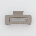 Beige hair clip on a white background