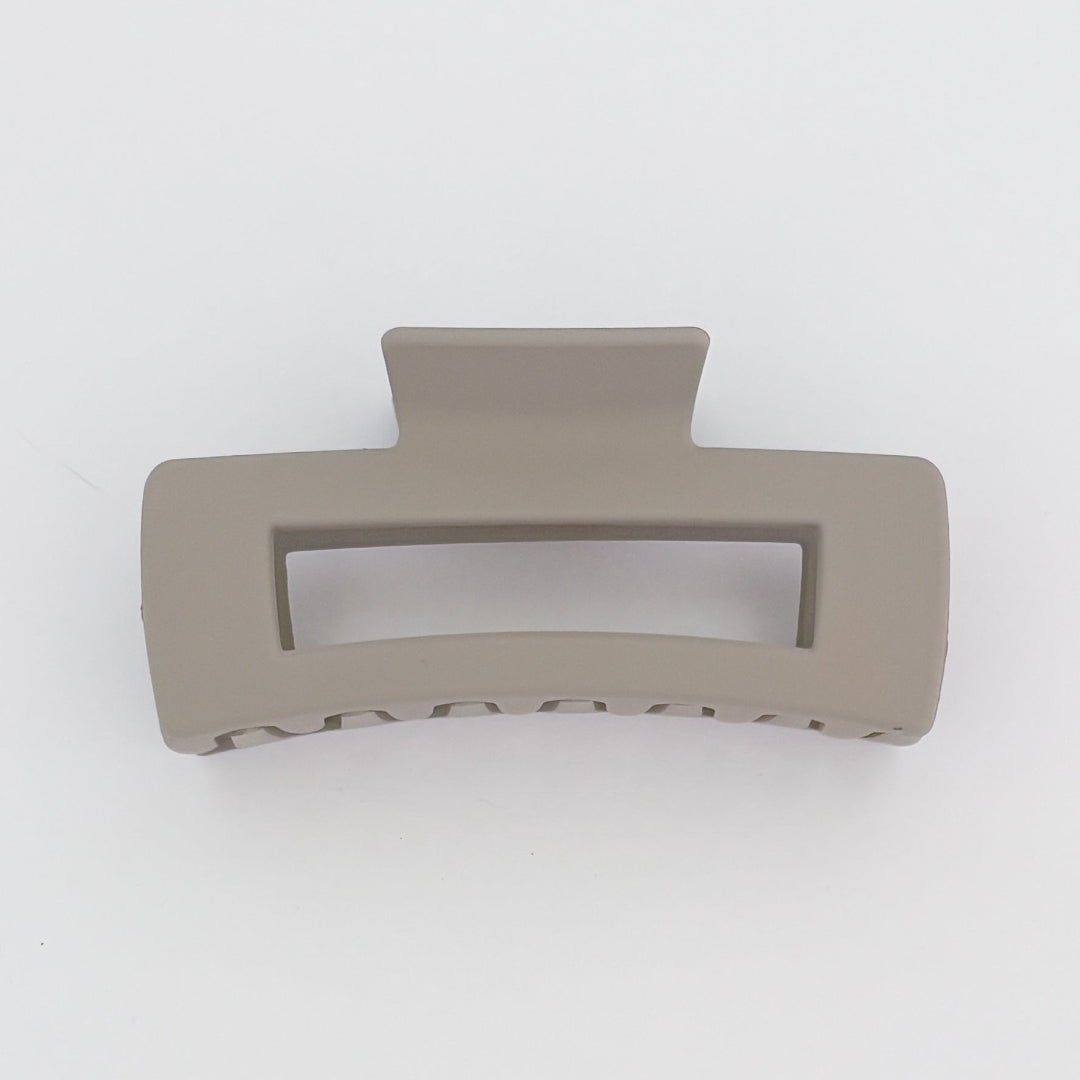 Beige hair clip on a white background